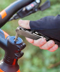 Using All In One Bike Tool Kit 17 Tools Stainless Steel Multi Tool for quick on-the-go bike repairs on handlebar