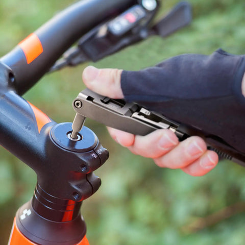Using All In One Bike Tool Kit 17 Tools Stainless Steel Multi Tool for quick on-the-go bike repairs on handlebar