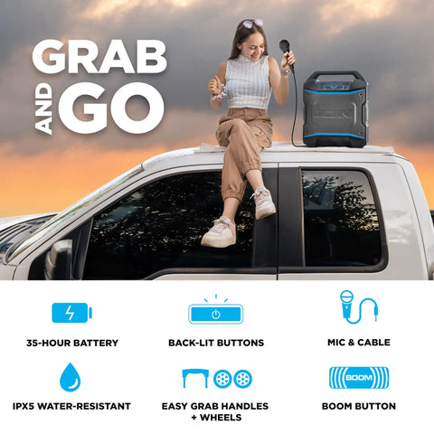 Woman with a microphone sitting beside Block Rocker Kickin Portable Bluetooth Outdoor Party Speaker on a car roof