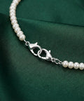 Silver double end lobster clasp with pearl necklace backdrop from the 20 Pcs Double End Lobster Clasp Set For DIY Jewelry Making.