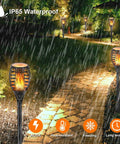 Low Voltage 12V Outdoor Torch Lights Set With Wired LED Flame Torches, IP65 Waterproof Landscape Pathway Lamps shown in garden.
