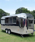 Lightweight Mobile Food Trailer With Full Plumbing And Electrical Wiring Solid Rig For Your Downtown Block Party Or Street Food Hustle Ready To Roll Smooth Today, shiny silver trailer on grass.