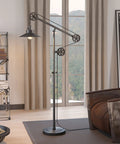 Go-To Pulley System Floor Lamp With Wide Brim Fabric Shade In Aged Steel Finish in a modern living room setting
