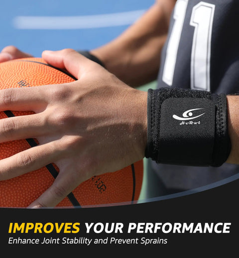 Close-up of hand wearing Two Pack Wrist Compression Straps for fitness, gripping basketball, enhancing joint stability.