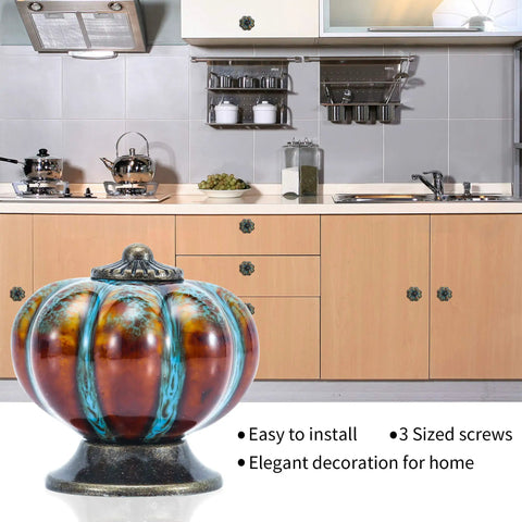 Durable Blue Pumpkin Cabinet Knobs 12 Pack Glazed Ceramic Vintage Door Pulls displayed in a kitchen setting with rustic cabinets.