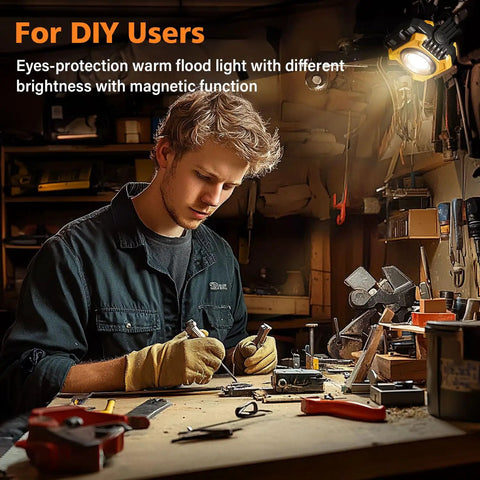 Person using Dual Sided Magnetic Work Light With 2400 Lumens Rechargeable Power Stepless Dimming 2700K To 8000K Color Temperature 360 Degree Rotating Stand And Built In Hook Up To 80 Hours Runtime in a workshop.