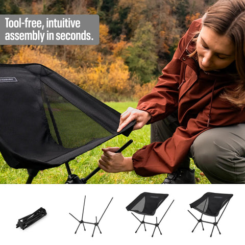 Person assembling Ultra Lightweight Compact Camping Chair With Low Back Minimalist Design Folds Into Small Carry Bag in field