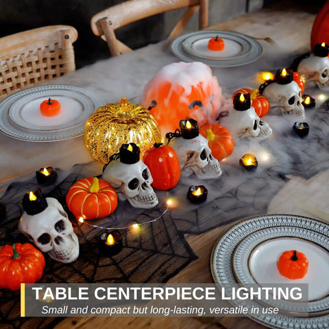Table setup featuring Dripping Black Flameless Tea Lights 24 Pack With Warm White Flickering LED Candles For Halloween Decor Safe Battery Operated Party Pumpkins Haunted Home Gothic Vibe Spooky Easy Setup No Flame amid skulls and pumpkins.