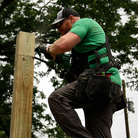Worker using 36V MultiVolt Brushless Reciprocating Saw Kit With 18V 36V Battery, Rapid Charger, Curved Wood Blade, Carrying Bag outdoors