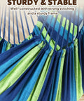 Close-up of colorful cotton fabric and straps of hammock chair swing for indoor outdoor relaxation in blue green.