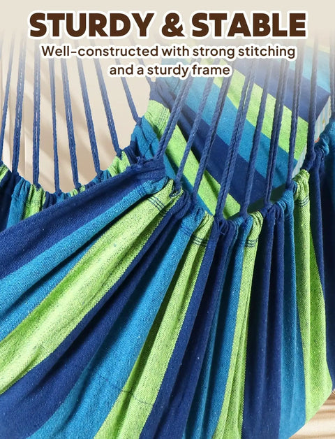 Close-up of colorful cotton fabric and straps of hammock chair swing for indoor outdoor relaxation in blue green.