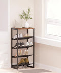 Hella Narrow Five Tier Shoe Rack With Classic Wooden Top Reinforced Steel Mesh holds ten pairs of sneakers in a compact hallway space.