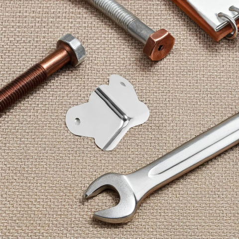 12 Pieces Metal Speaker Cabinet Corner Guards 1.57 Inch Silver Edge Protectors With Screw Holes next to bolts and wrench