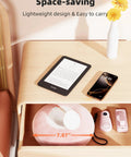 Magnetic Kindle Holder With Page Turner For Reading In Bed, pink pillow stand in drawer, small devices on wooden surface