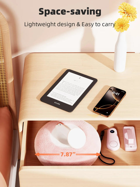 Magnetic Kindle Holder With Page Turner For Reading In Bed, pink pillow stand in drawer, small devices on wooden surface