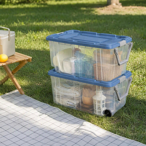 2 Pack 160 Quart Heavy Duty Rolling Storage Bins With Clear Transparent Walls And Tough Latching Lids For Smooth Glide Action outdoors stacked with household items.