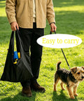 Person carrying All In One Dog Agility Jump Set For Backyard Training with carry bag next to small dog on grass
