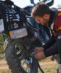 Man using Compact Roll Up Motorcycle Tool Bag With MOLLE Strap For Grab-And-Go Kit, Wrench Roll Organizer Pouch on bike