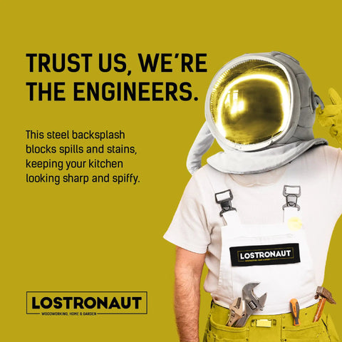Astronaut figure with tools promoting stainless steel kitchen wall backsplash product