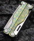 Ultra Lightweight Titanium Alloy Multitool Pliers With Camouflage Finish closed on black rock surface