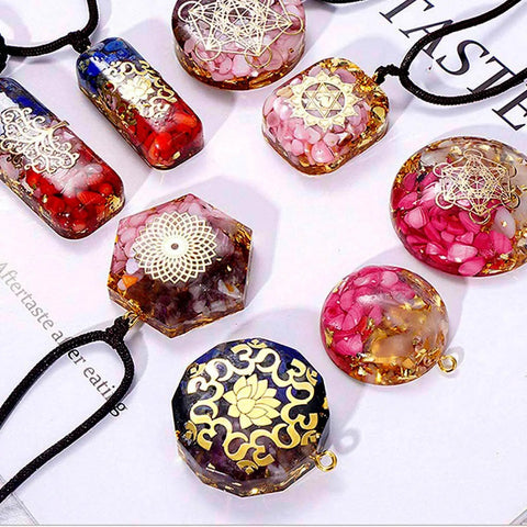 Colorful resin pendants with intricate designs from the All In One Resin Kit For Beginners And Pros With 125 Pieces Jewelry Making Set.