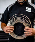 Front view of a person holding a 1/4-inch copper-nickel brake line coil