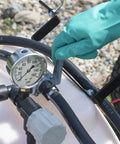 Close-up of pressure gauge and hose on Tow Behind Sprayer With 60 Gallon Capacity, 4 GPM Diaphragm Pump, 100 PSI, 120 Inch Boom