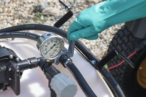 Close-up of pressure gauge and hose on Tow Behind Sprayer With 60 Gallon Capacity, 4 GPM Diaphragm Pump, 100 PSI, 120 Inch Boom