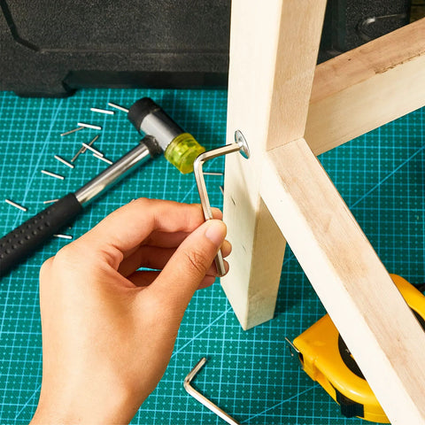 Spring Loaded Door Hinge Pin Replacement Kit With 12 Stainless Steel Shelf Pins And 2 Hex Wrenches For Self Closing Doors Fits Three Point Five Inch Four Inch And Four Point Five Inch Pins No Brainer Easy Diy Install Durable Heavy Duty Hardware being used on wooden frame