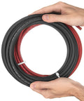 Hands holding 4 Gauge Premium Copper Welding Cable Set, Extra Flexible Pro Grade 600 Volt, 15 Feet Black and 15 Feet Red