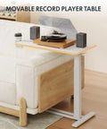 32 Inch Mobile Standing Desk Featuring A Slick Rolling Base And Hassle Free Pneumatic Height Adjustments With Smooth One Hand Gas Spring Lift For Compact Home Office Computer Workstation Setup used as a record player table.