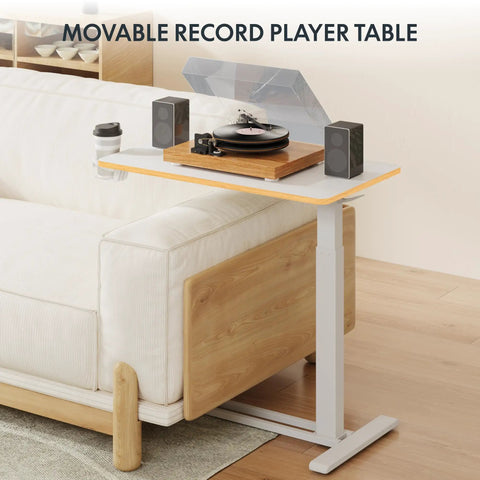 32 Inch Mobile Standing Desk Featuring A Slick Rolling Base And Hassle Free Pneumatic Height Adjustments With Smooth One Hand Gas Spring Lift For Compact Home Office Computer Workstation Setup used as a record player table.