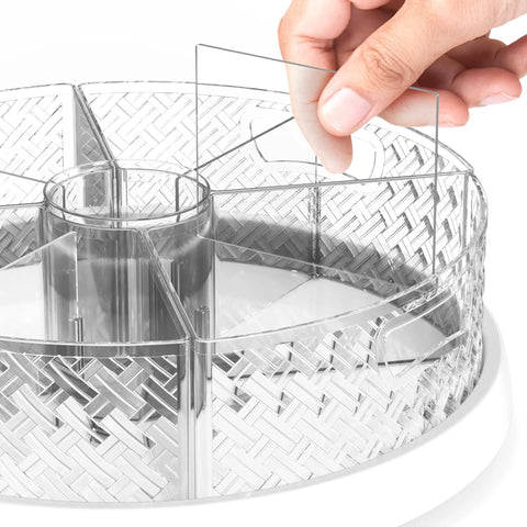 Hand adjusting divider in 12 Inch Lazy Susan Turntable with Removable Bins and Dividers, a game changing kitchen organizer