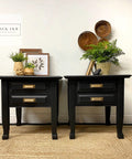 Two black end tables painted with Chalk Mineral Furniture Paint Matte Black Caviar 16oz, styled with decor items.