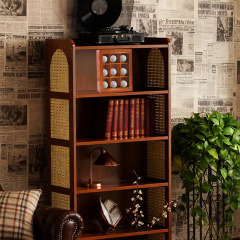Wooden cabinet with nine hole golf ball display case and vinyl player on top, next to vintage wallpaper and green plant.