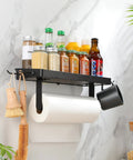 Garage Paper Towel Holder With Shelf And Hooks, Black Stainless Steel Wall Mount Organizer displayed with spices and brushes