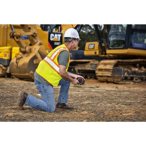 Worker using Three Eighths Inch By Fifty Foot Steel Construction Long Tape Measure With Three To One Gear on site