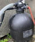 1.5 Inch Pool Replacement Hose For Above Ground Pools attached to black filtration system, showing connections and fittings.