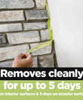 Rugged Painter's Tape For Rough Surfaces 1 Inch By 60 Yard Green 4 Pack, sticking to brick wall, demonstrating clean removal.
