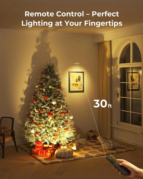 Rechargeable Indoor LED Spotlight Kit with Smart Auto Timer illuminating a Christmas tree and artwork using remote control.