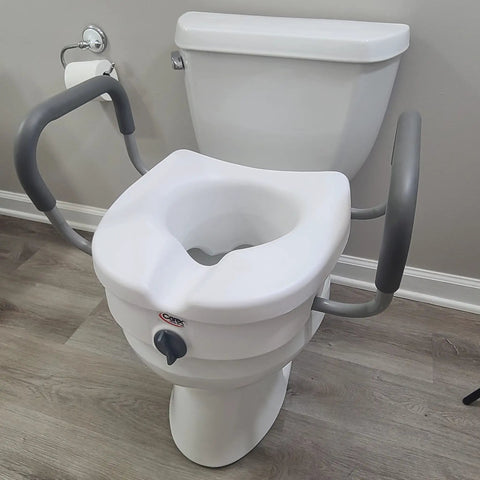 EZ Lock Toilet Seat Riser with Safety Frame, 5 inch lift with padded handles, installed on elongated toilet, secure locking design.