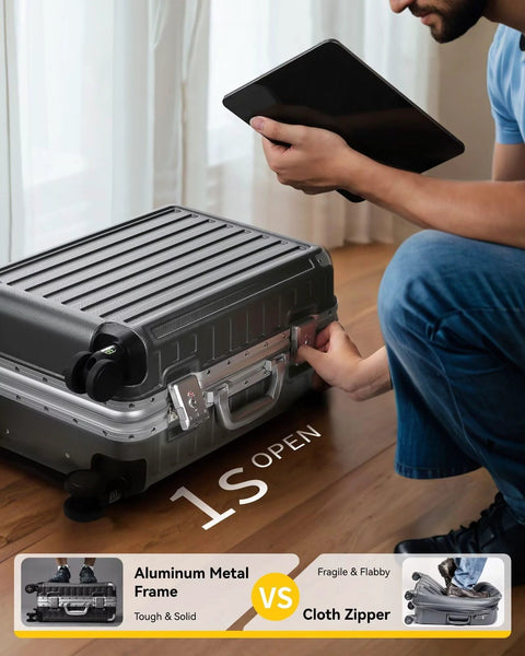 Carry-on luggage with spinner wheels, 20-inch charcoal aluminum-frame hard-shell case beside a person holding a tablet.