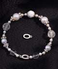 Sterling Silver 925 Oval Jewelry Clasp Hypoallergenic Connector With Ring 12x7mm displayed with decorative bracelet