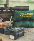 TackDriver Gun Bag With One Piece Construction And Non Marring Surface For Outdoor Range And Hunting on a wooden bench.