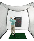 Golfer using 10x10x10 golf net cage with target for indoor and outdoor practice, knotless hitting net, ideal for year-round training