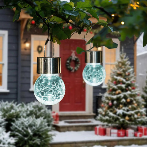 8 Pack Outdoor Solar Hanging Lights Waterproof Lanterns For Garden Decor Cold White Cracked Glass glowing in snowy garden scene