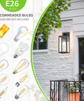Durable Black Exterior Wall Lanterns With Hella Weatherproof Build For Backyards And Patios mounted on a wall with recommended E26 bulbs.