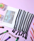32 Pack Mesh Zipper Bags Set For Grab And Go Travel And Home Organization Waterproof Reusable Pouches In Black 9 By 7 Inch Perfect For Storing Swimwear Toys Lingerie Office Supplies And More, displayed with colored pencils and glasses.