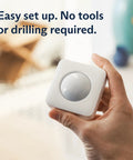 Dope Indoor Motion Sensor For Gen 3 Home Security System That Detects Movement Up To 30 Feet With A 90 Degree Field Of View For Corner Coverage In Large Rooms And Pet Friendly Design, white sensor in hand