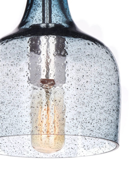 Close-up of blue hand-blown glass pendant light for kitchen island in modern farmhouse style ceiling hanging fixtures.